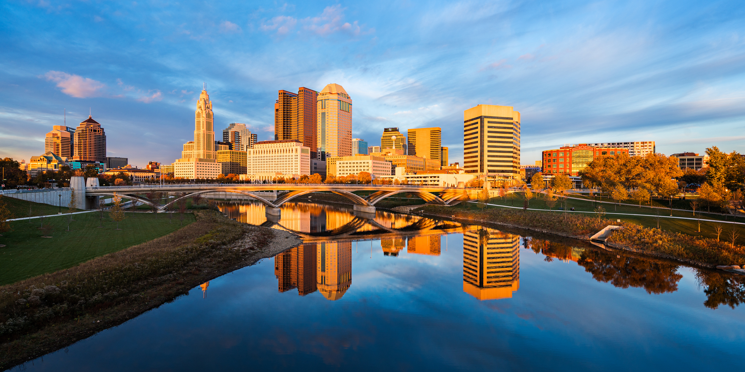 Columbus, Ohio skyline at sunrise reflected in the Scioto River